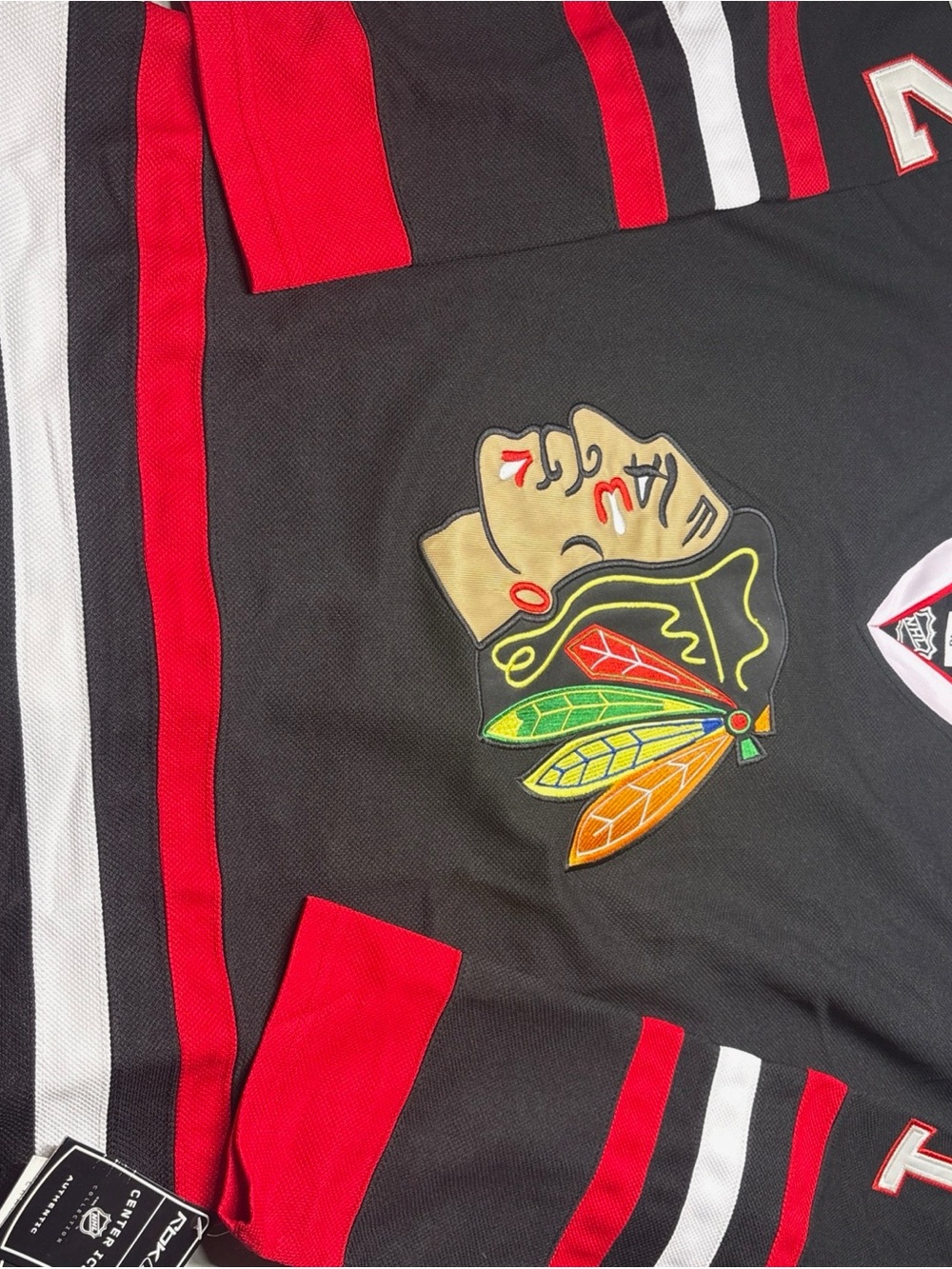 Reebok Black Jersey with Multicolor Native Headdress Embroidery